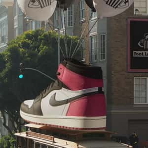 Sneaker on Balloons Lands on Cable Car in a fake-out-of-home ad of Foot Locker