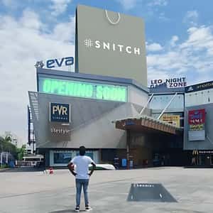 Shopping Bag Emerges Above the Mall in a fake-out-of-home ad of Snitch