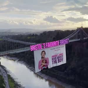 Poster Rolls Below the Bridge in a fake-out-of-home ad of Universal Pictures