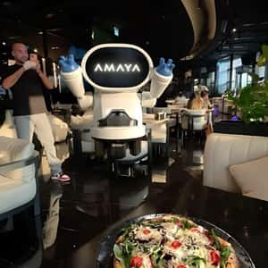 Flying Robot Serves Pizza in a fake-out-of-home ad of Amaya