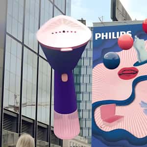 Handheld Steamer Emerges From Billboard in a fake-out-of-home ad of Philips