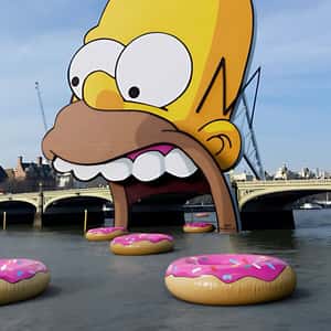 Inflatable Donuts Floating on River in a fake-out-of-home ad of Disney Plus