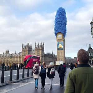 Big Ben Wears a Purple Hair in a fake-out-of-home ad of Disney Plus