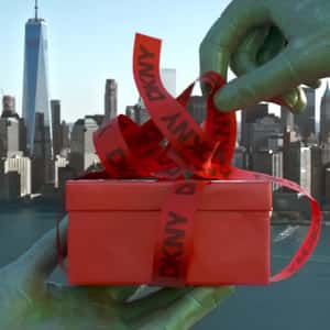 Statue of Liberty Unwraps Gift Box n a fake-out-of-home ad of DKNY