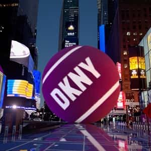 Tennis Balls Rolling at Times Square in a fake-out-of-home ad of DKNY