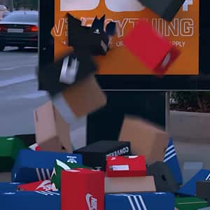 Shoe Boxes Burst Out From Street Ad in a fake-out-of-home ad of Foot Locker