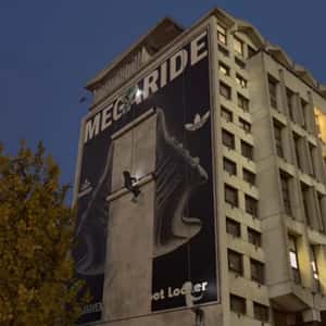 Aliens Installing Billboard on Building in a fake-out-of-home ad of Foot Locker
