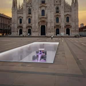 F1 Car Transformed into Football Shoe in a fake-out-of-home ad of PUMA