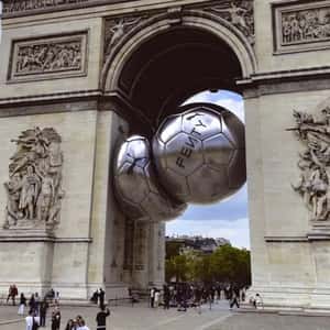 Soccer Balls Stuck in Different Landmarks in a fake-out-of-home ad of PUMA