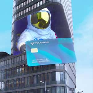 Card Emerges From Digital Screen in a fake-out-of-home ad of Volksbank