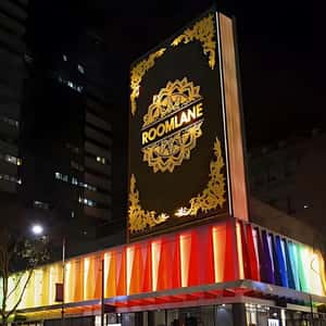 Book Flips Open Above the Roof in a fake-out-of-home ad of Room Lane Furniture