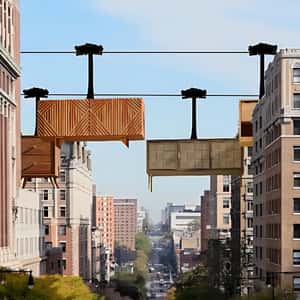 Side Cabinets Glide Like Cable Cars in a fake-out-of-home ad of Room Lane