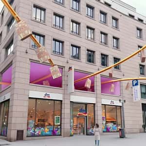 Shopping Bags Gliding on the Conveyor in a fake-out-of-home ad of DM