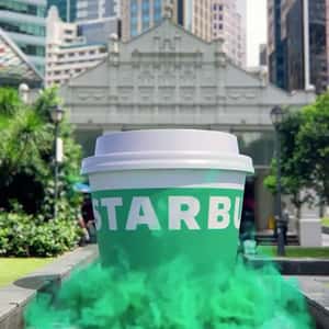 Coffee Cup Emerges on Path in a fake-out-of-home ad of Starbucks