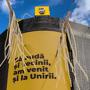 Noodles Hanging on Chop Sticks in a fake-out-of-home ad of Noodle Pack