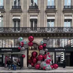 Christmas Balls Rolling Towards the Store in a fake-out-of-home ad of Sephora