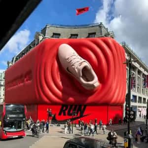 Running Shoe Stomping on 3D Billboard in a fake-out-of-home ad of Nike