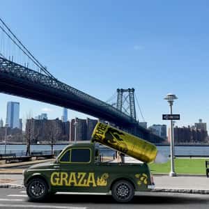 Pick Up Truck with Spraying Oil Bottle in a fake-out-of-home ad of Graza