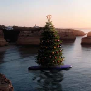 Christmas Tree Rides on Paddle Board in a fake-out-of-home ad of Club Med