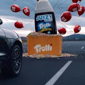 Box Overflowing with Gummies in a fake-out-of-home ad of Kaufland