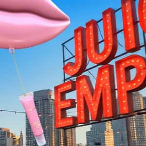 Pink Lip Balloon Carries Lip Gloss in a fake-out-of-home ad of Lancôme