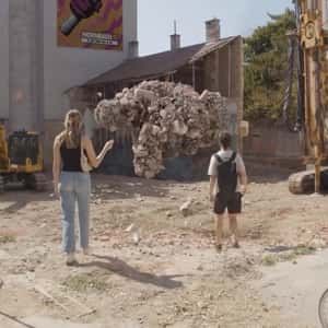 Stones Forming a Beckoning Hand in a fake-out-og-home ad of HORNBACH