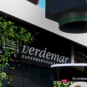 Chocolate Machine Coat Grapes in a fake-out-of-home ad of Verdemar