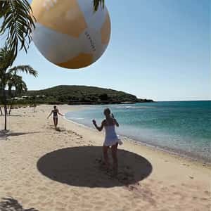 Women Playing Beach Ball in a fake-out-of-home ad of Sephora