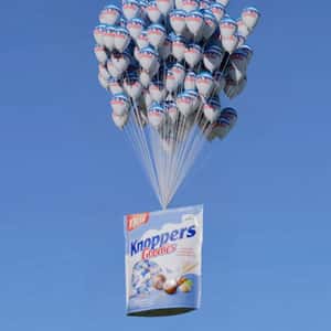 Chocolate Wafer Bag Carried by Balloons in a fake-out-of-home ad of Knoppers