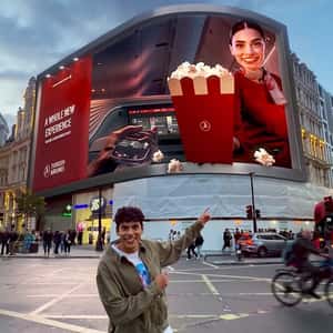 Popcorn Emerges From Digital Screen in a fake-out-of-home ad of Turkish Airlines