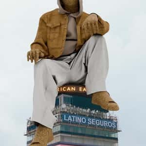 Sand Man Sits on Top of Building in a fake-out-of-home ad of American Eagle