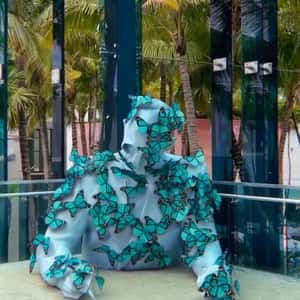 Sculpture Covered with Butterflies in a fake-out-of-home ad of Miami Design District