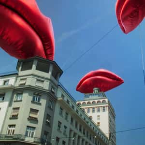 Inflatable Red Lips Above the Bank in a fake-out-of-home ad of Smile