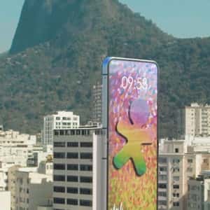 Flip Phone Opens as it Hangs on Building in a fake-out-of-home ad of Vivo