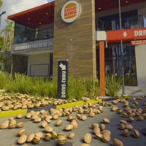 Pistachio Nuts Raining at Restaurant in a fake-out-of-home ad of Burger King