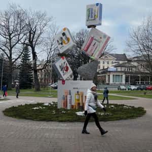 Stacked Product Boxes Balancing in a fake-out-of-home ad of MÁDARA