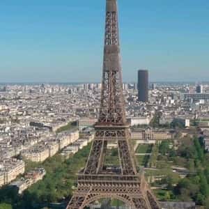 Purple Fuzzy Inflatables Bumps onto Eiffel Tower in a fake-out-of-home-ad of Vivo