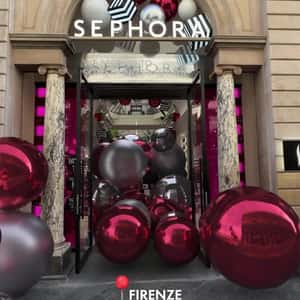 Christmas Balls Roll in Different Streets in a fake-out-of-home ad of Sephora