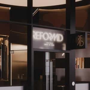 Workout Equipments Roll On Railway in a fake-out-of-home ad of Reformd