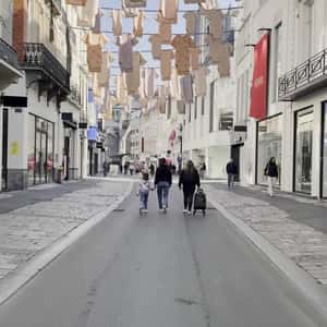 Baby Clothes Hanging Above Shopping Street in a fake-out-of-home ad of HEMA