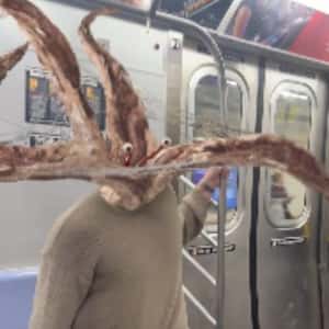 Parasyte Enter Man’s Ear in a fake-out-of-home ad of Netflix