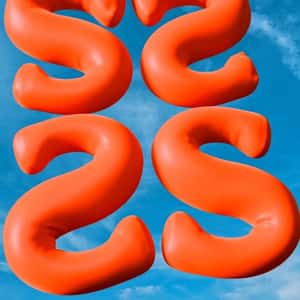 Orange Letter Balloons Float in a fake-out-of-home ad of Shopbop