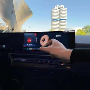 Donut Emerges From Dashboard Screen in a fake-out-of-home ad of BMW