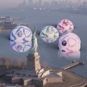 Soccer Balls Drop Near Statue of Liberty in a fake-out-of-home ad of FC Porto