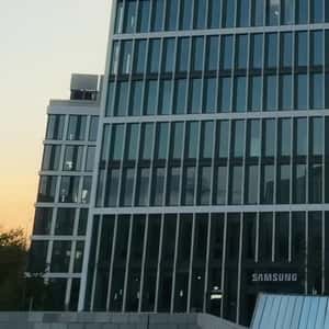 Crane Places Bank Card on Billboard in a fake-out-of-home ad of Samsung