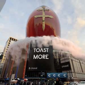 Cognac Bottle Ascends at Arena in a fake-out-of-home ad of D’USSÉ