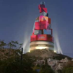 Gift Boxes Christmas Tree on a Hill in a fake-out-of-home ad of Sephora