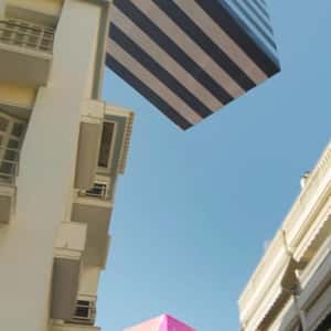 Gift Boxes Floats Above Buildings in a fake-out-of-home ad of Sephora