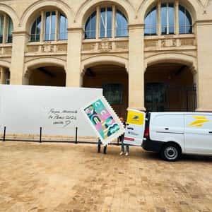 Crews Put Post Stamp on Envelope in a fake-out-of-home ad of La Poste