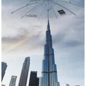 Clear Umbrella Opens Above the Building in a fake-out-of-home ad of BrandDubai